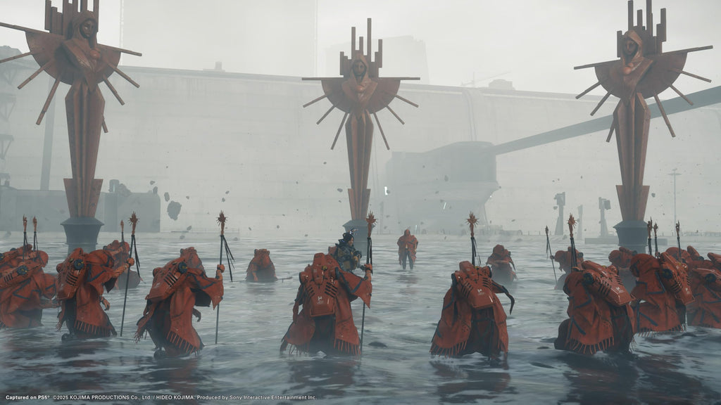 Death Stranding 2 Collector's Edition PS5 game scene showing cloaked figures standing in water around tall statues