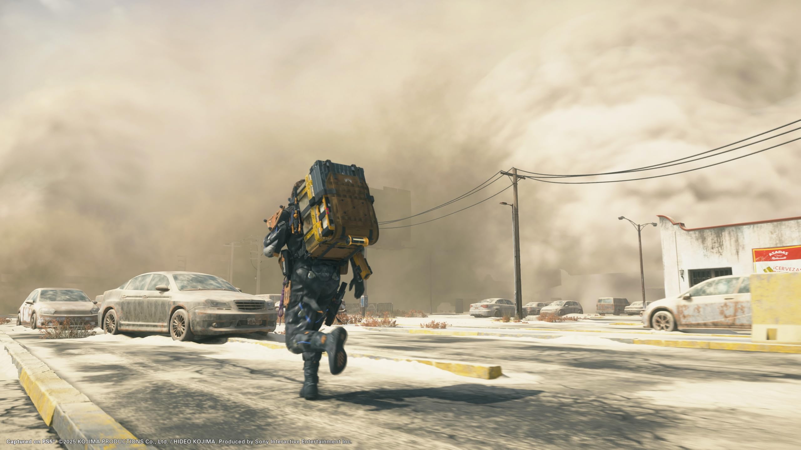 Player character carrying large backpack running through dusty urban area in Death Stranding 2 Collector's Edition PS5