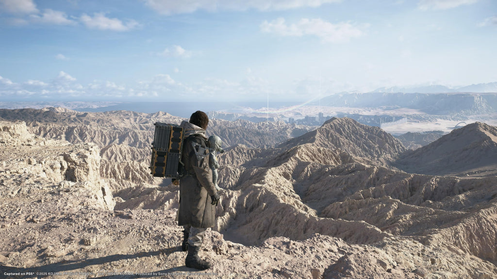 Scenic mountain view from Death Stranding 2 Collector's Edition PS5 game featuring a character in a rugged landscape