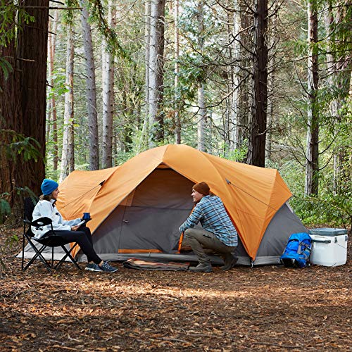 Craques dome camping tent with rainfly set up in forest with two people enjoying outdoor camping