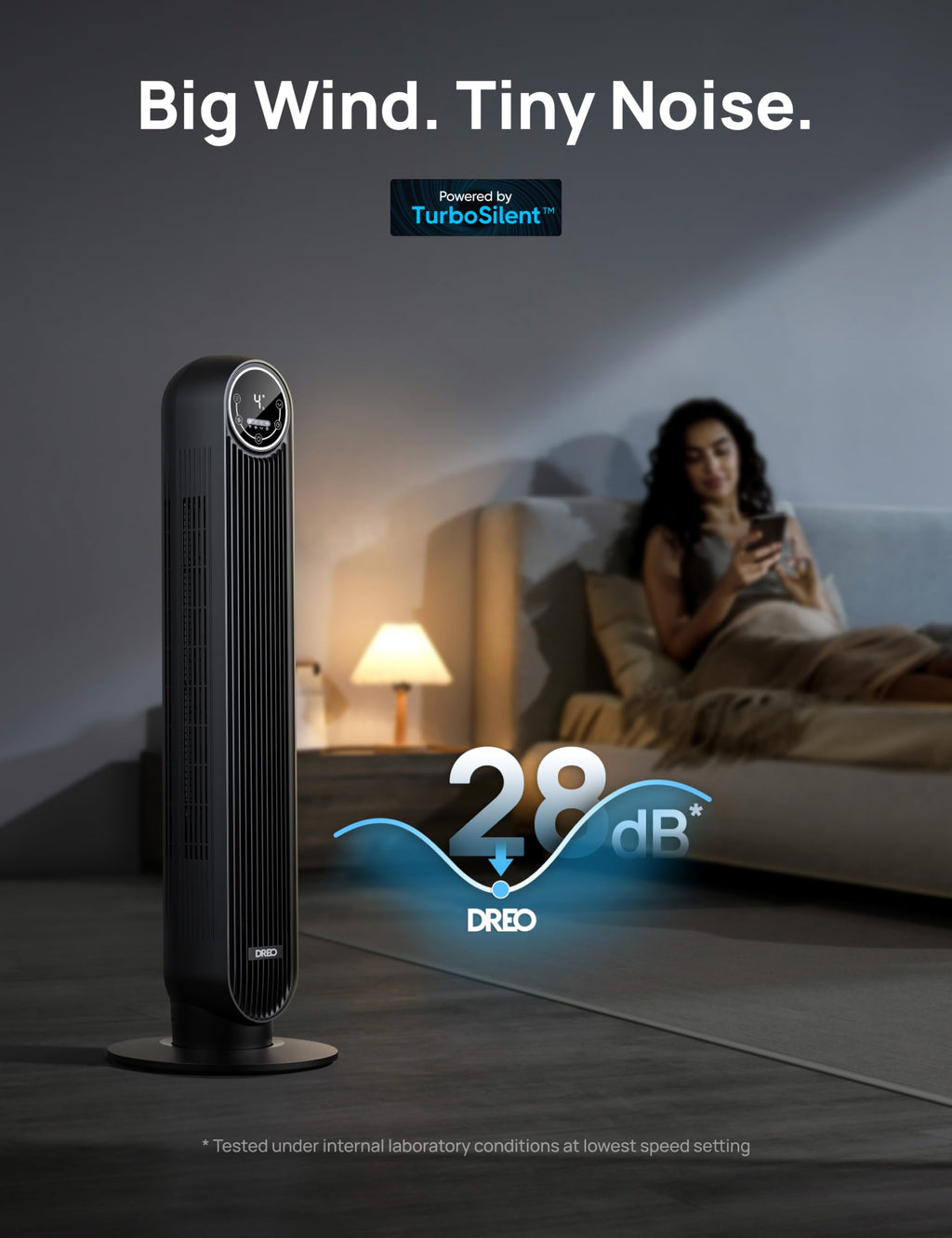 Craques black quiet tower fan for bedroom operating quietly at 28 decibels near a woman relaxing on a bed