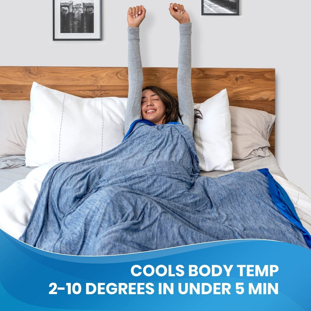 Woman stretching in bed wrapped in Everlasting Comfort cooling blanket by craques with blue fabric