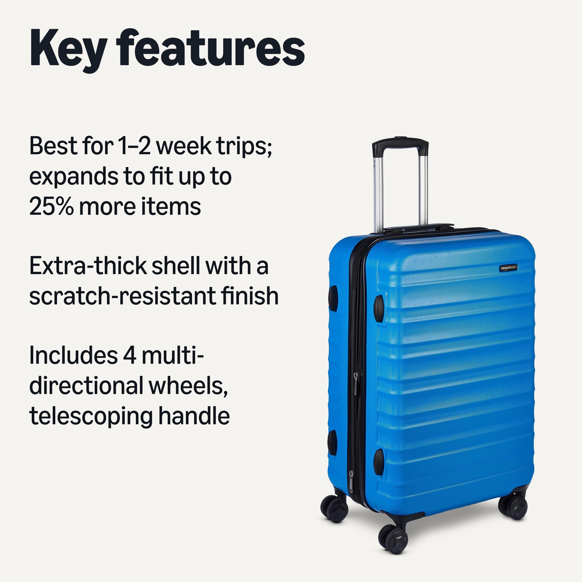 Blue expandable hardshell luggage set with telescoping handle and four multidirectional wheels