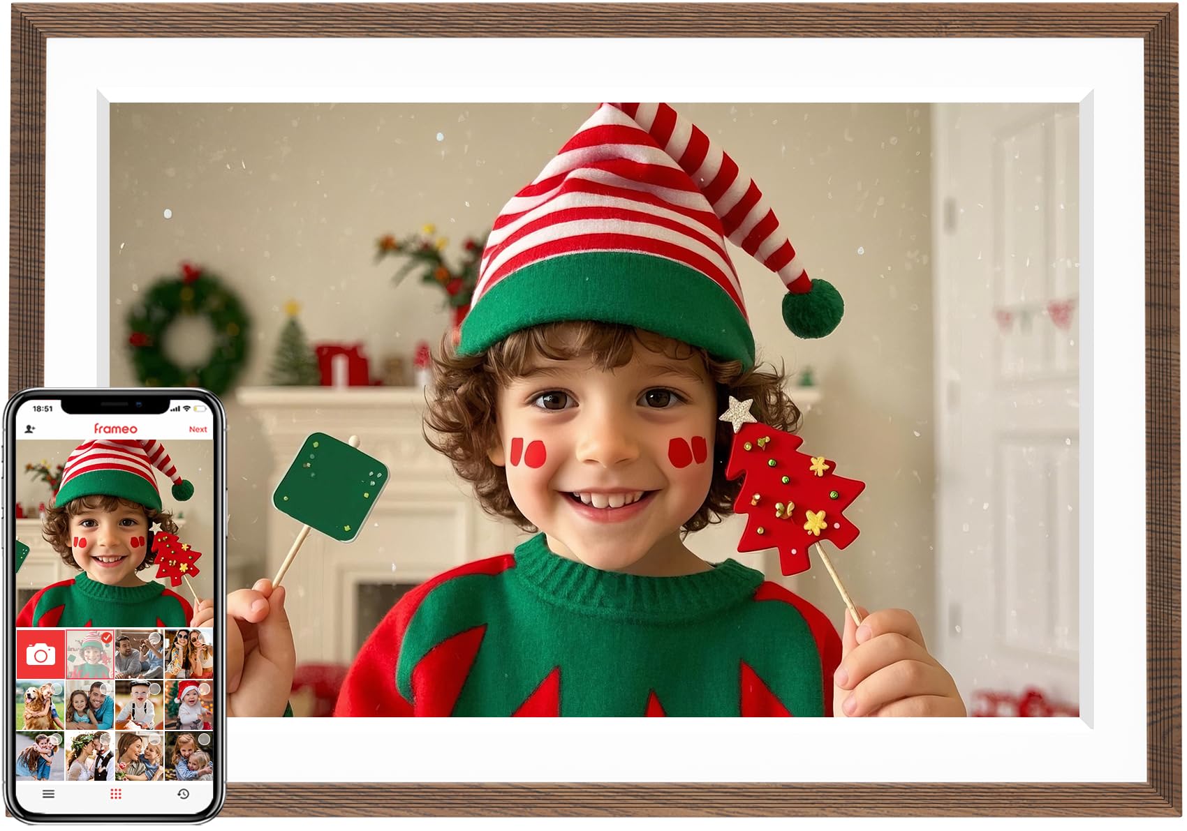 Frameo Wifi digital picture frame displaying a festive child in a Christmas elf costume with holiday decorations in background