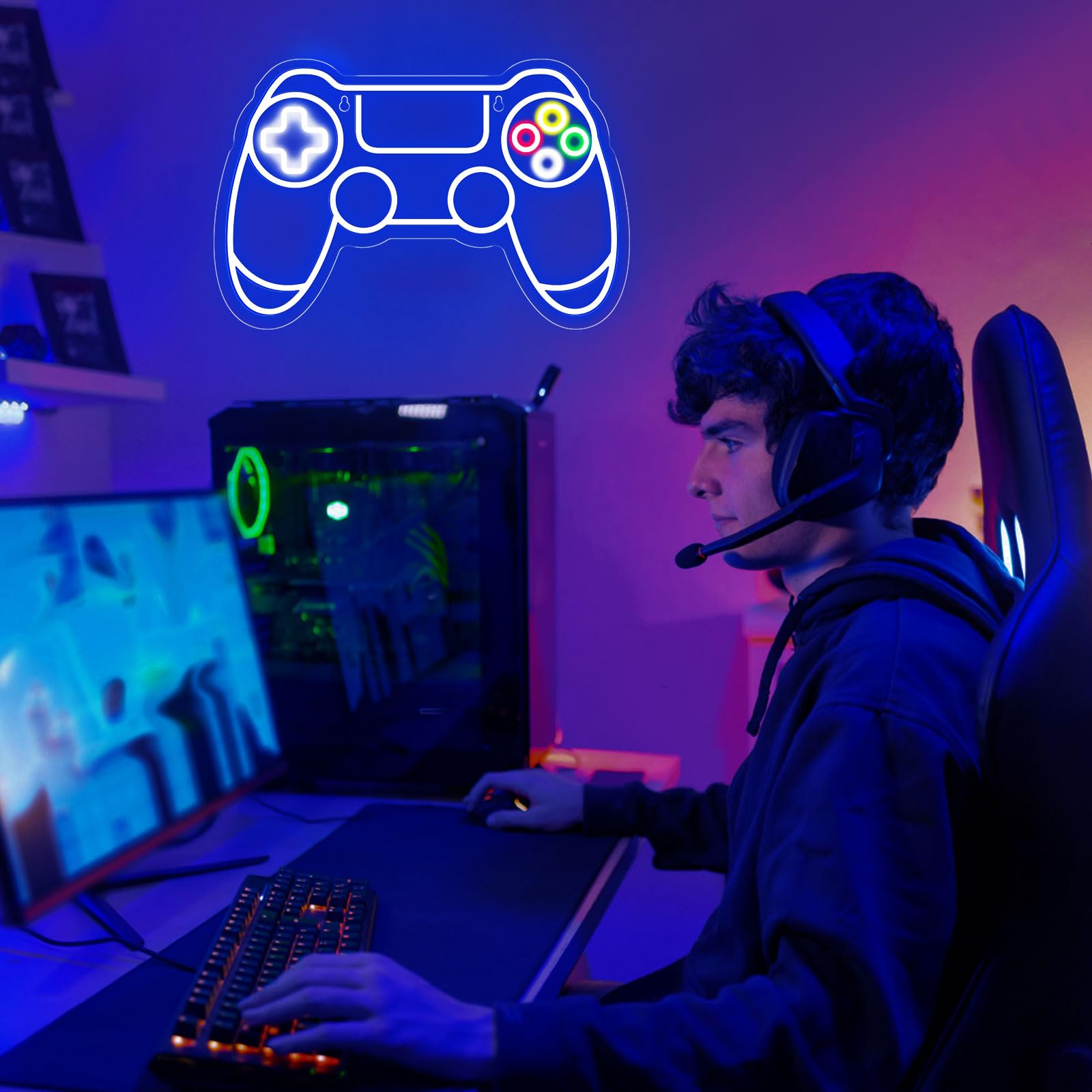 Gamer neon sign shaped like a controller glowing above a young man playing video games with headset