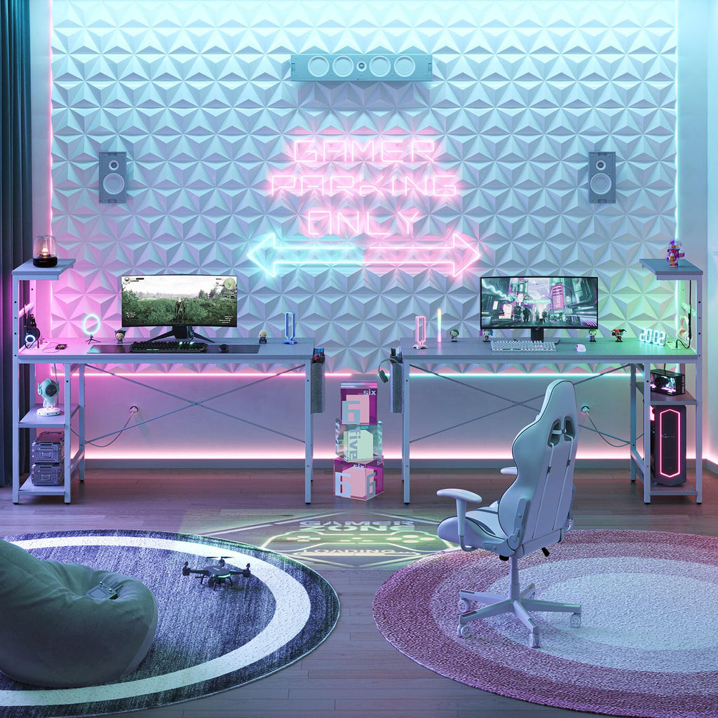 61 inch gaming desk with power outlets in a neon-lit dual gamer setup with monitors and gaming chair