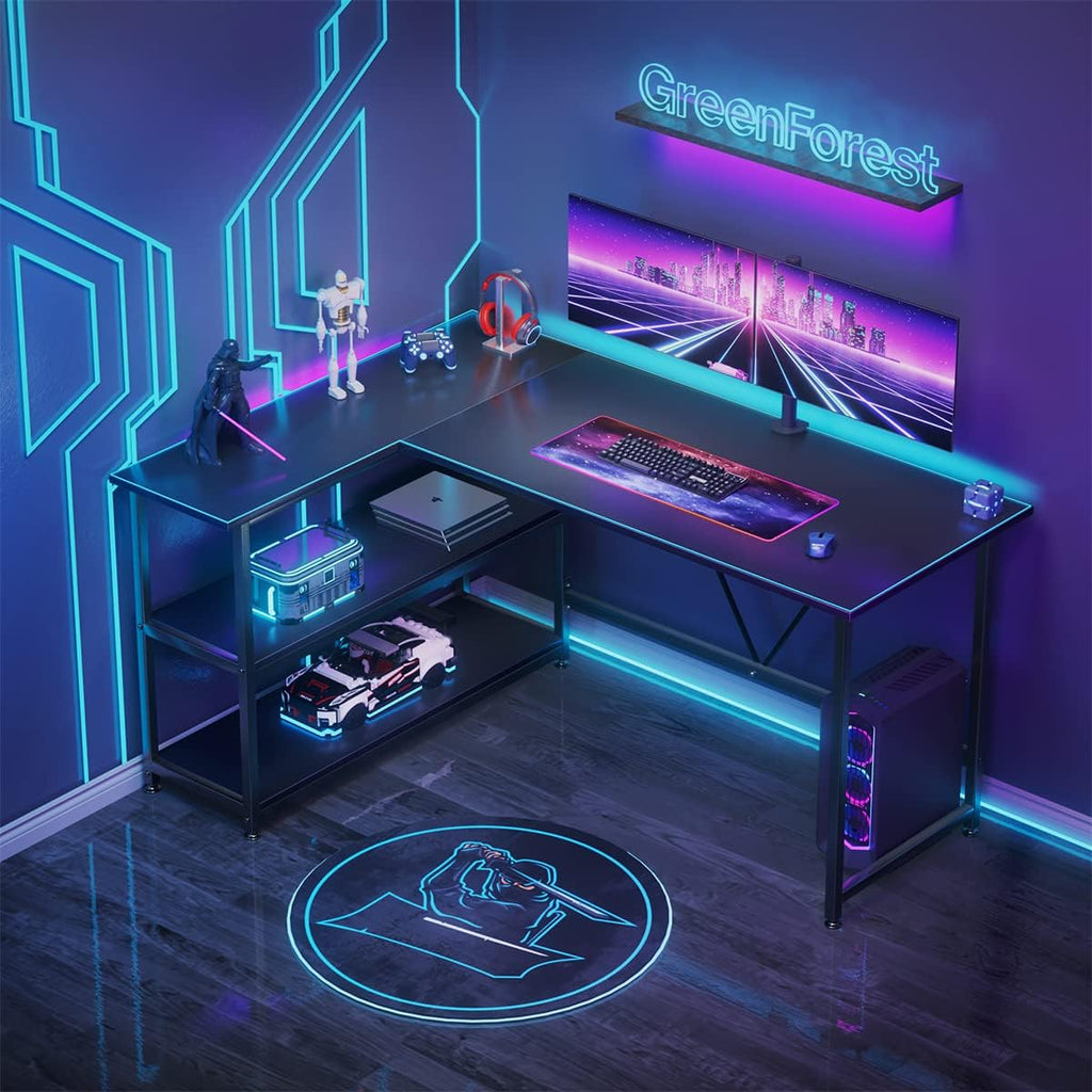Black L shaped gaming desk with shelves featuring LED lighting and gaming accessories setup