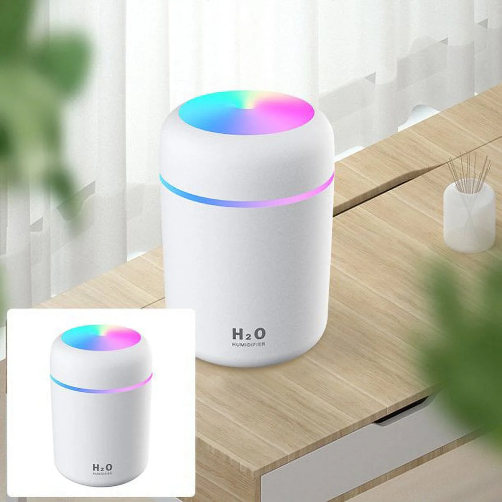 Craques portable mini humidifier with colorful LED light on wooden table near window