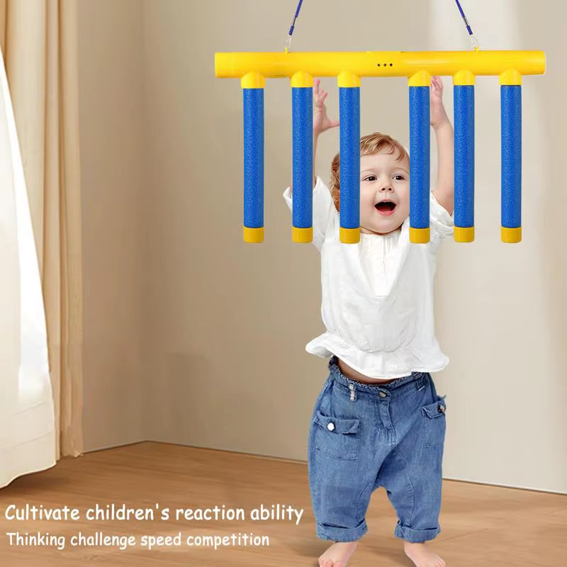 Toddler playing with a colorful hanging kids reaction training game to improve reaction ability