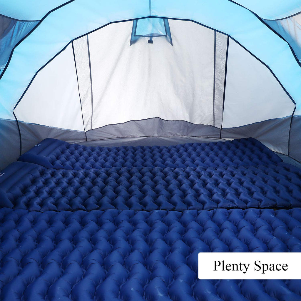 Interior view of a 6 person pop up camping tent with blue inflatable sleeping pads inside