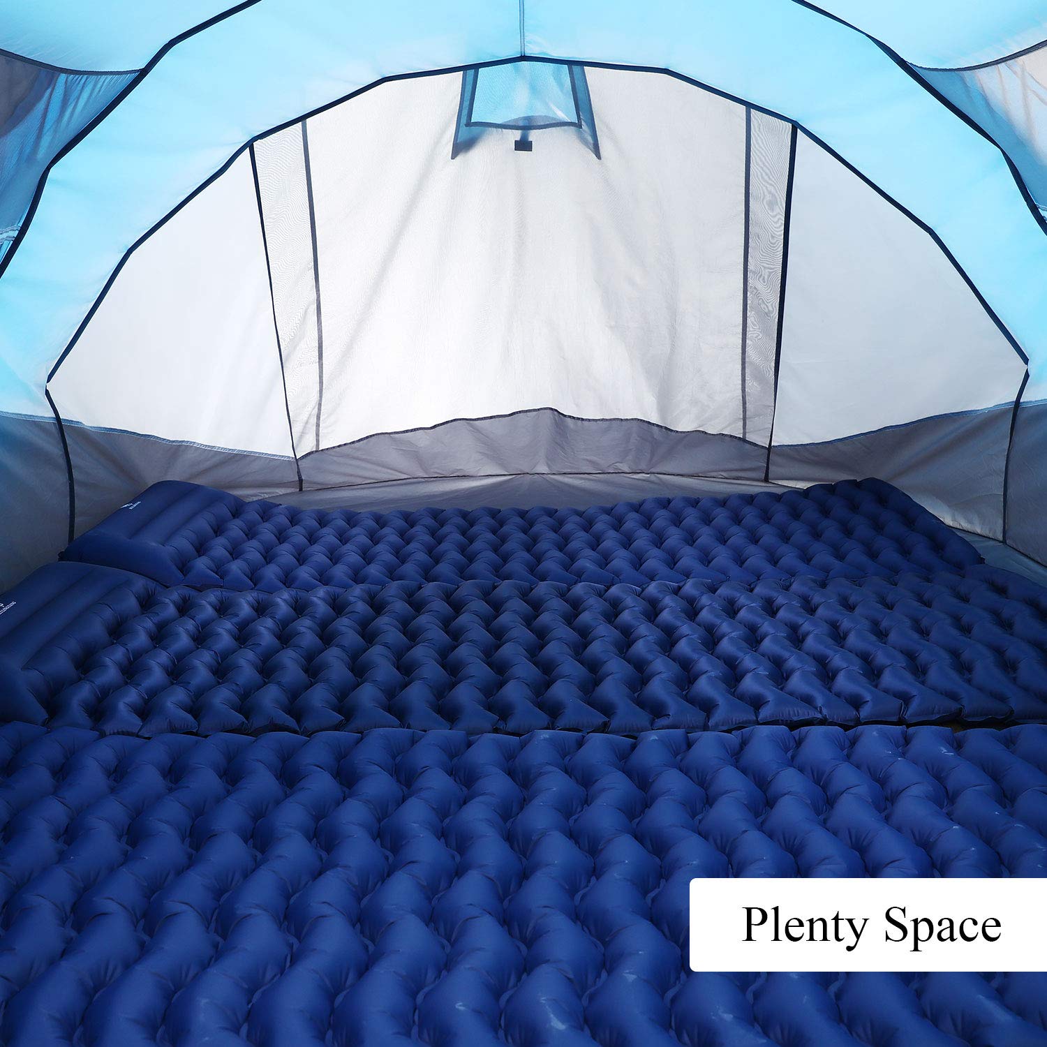 Interior view of a 6 person pop up camping tent with blue inflatable sleeping pads inside