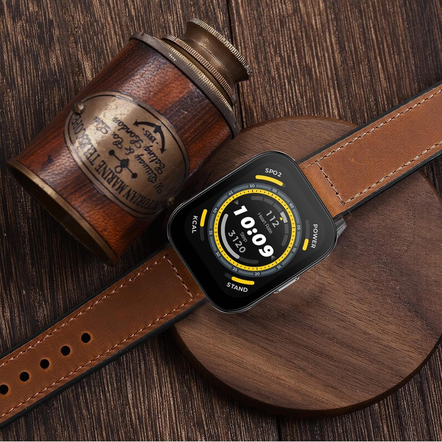 ID208 plus watch band replacement with brown leather strap displayed on wooden surface