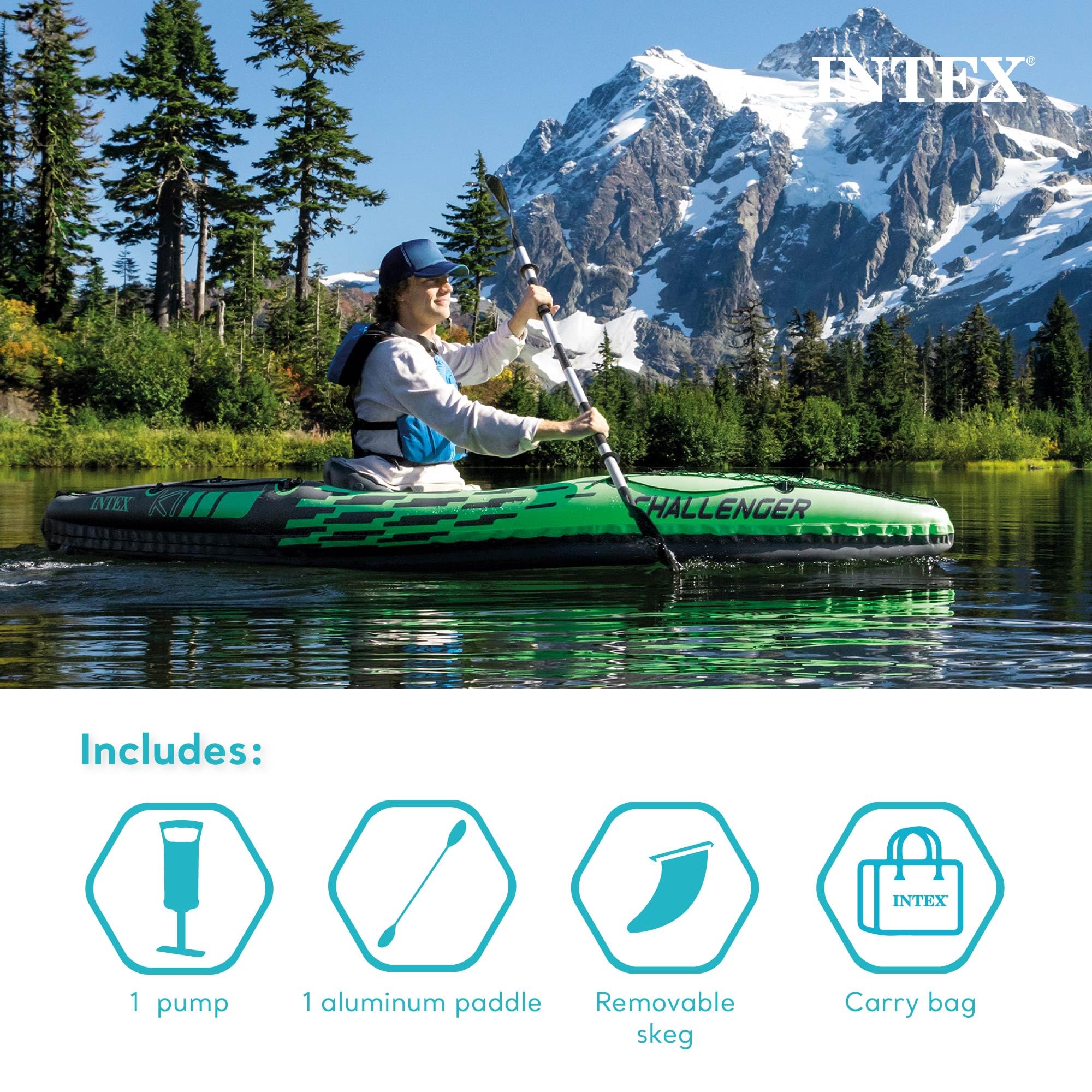 Woman paddling Intex Challenger inflatable kayak on calm lake with mountains and trees in background