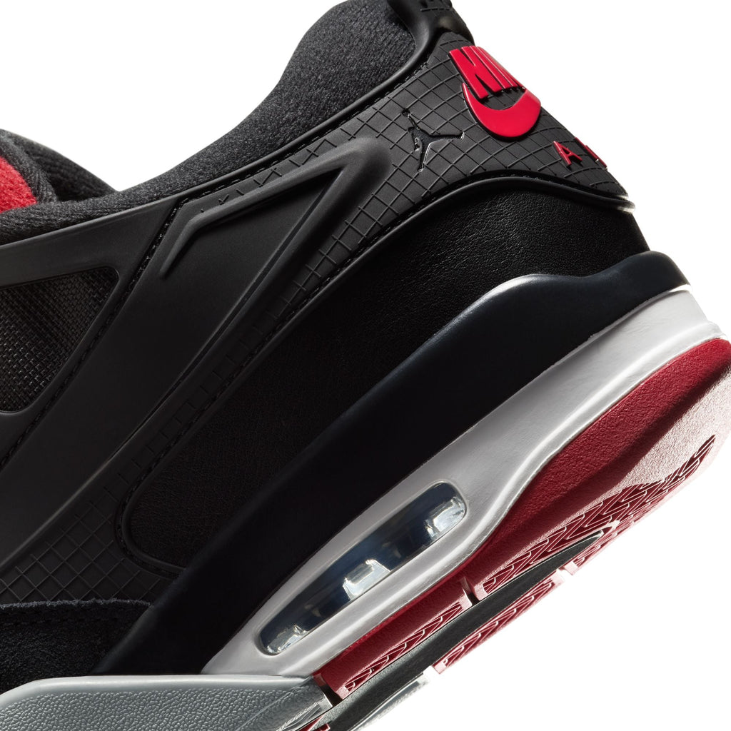 Air Jordan 4 RM men's sneakers featuring a sleek black design with red accents and visible air cushioning