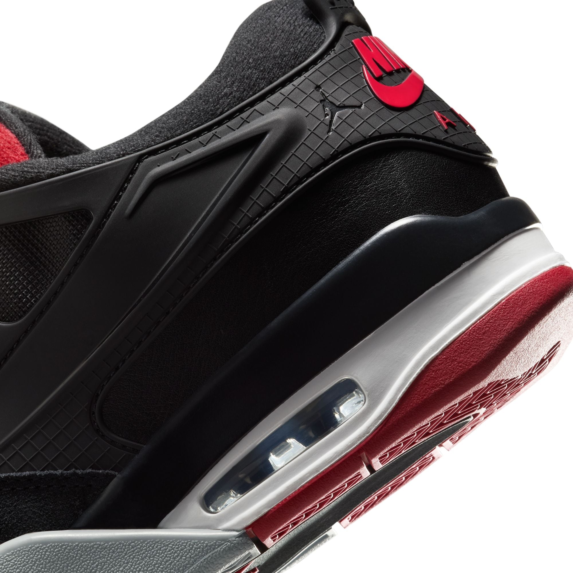 Air Jordan 4 RM men's sneakers featuring a sleek black design with red accents and visible air cushioning