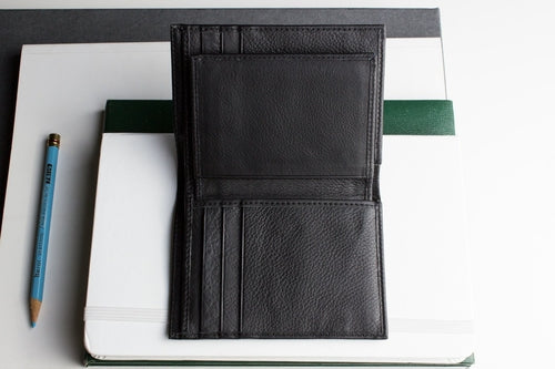 Slim passcase wallet for men in black leather with multiple card slots and a sleek design