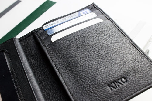 Black leather slim passcase wallet for men with multiple card slots and sleek design