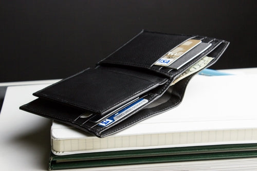 Black slim passcase wallet for men with multiple card slots and cash compartment