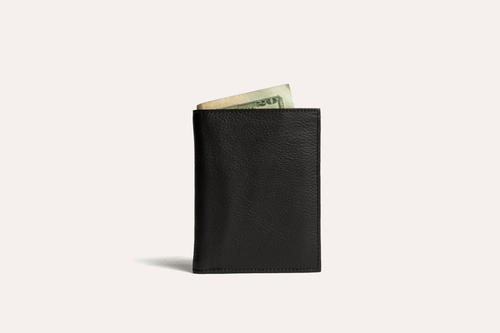 Stylish black slim passcase wallet for men with currency tucked inside