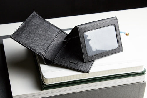 Stylish black slim passcase wallet for men with a clear ID window and multiple card slots