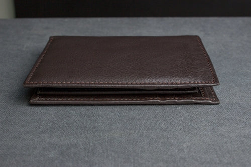 Brown leather slim passcase wallet for men with a sleek design and multiple card slots