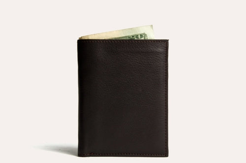 Craques slim passcase wallet for men in dark leather with cash peeking out