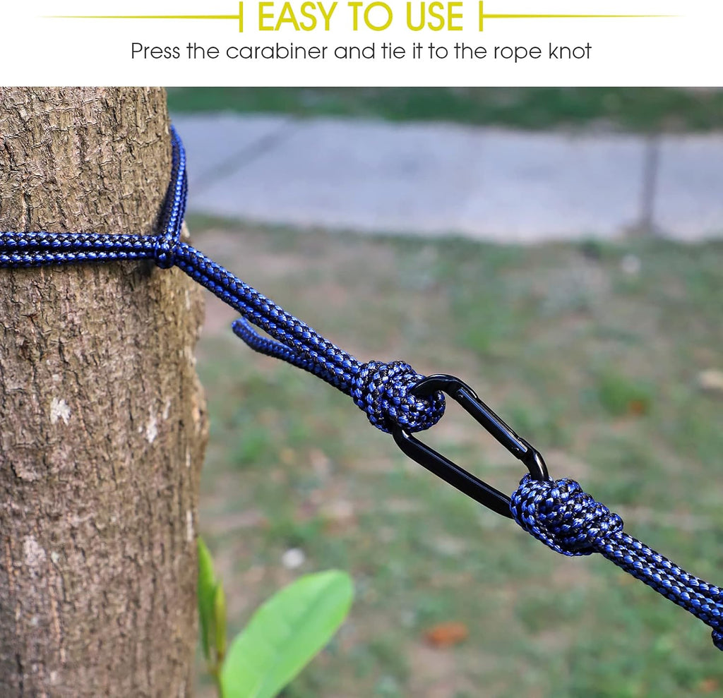 Close-up of carabiner and rope knot on double camping hammock with ropes tied to tree