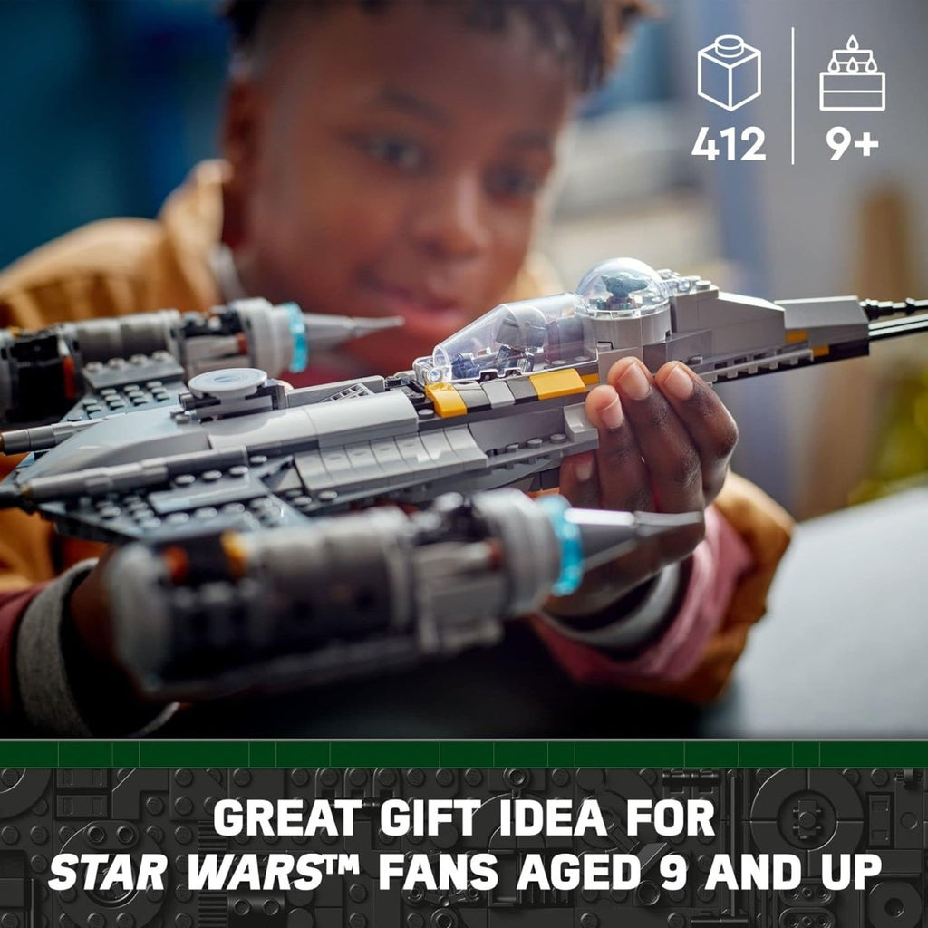 Child holding LEGO Star Wars N-1 Starfighter set with 412 pieces suitable for ages 9 and up