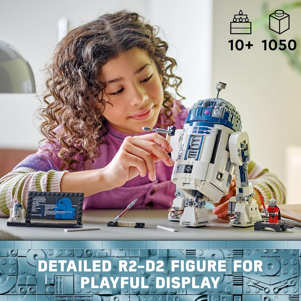 Child assembling the detailed LEGO Star Wars R2-D2 set with over 1050 pieces for playful display