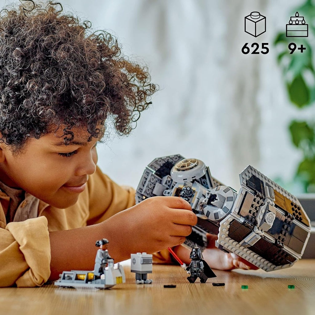 Child playing with LEGO Star Wars TIE Bomber set featuring 625 pieces and Star Wars minifigures