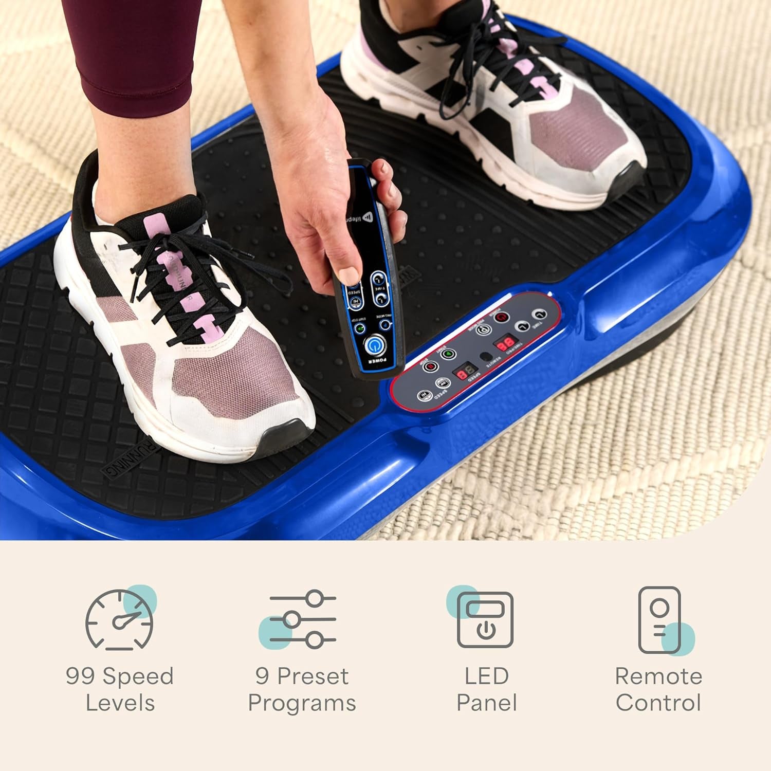 Person using remote control on craques vibration plate exercise machine with LED panel and 99 speed levels
