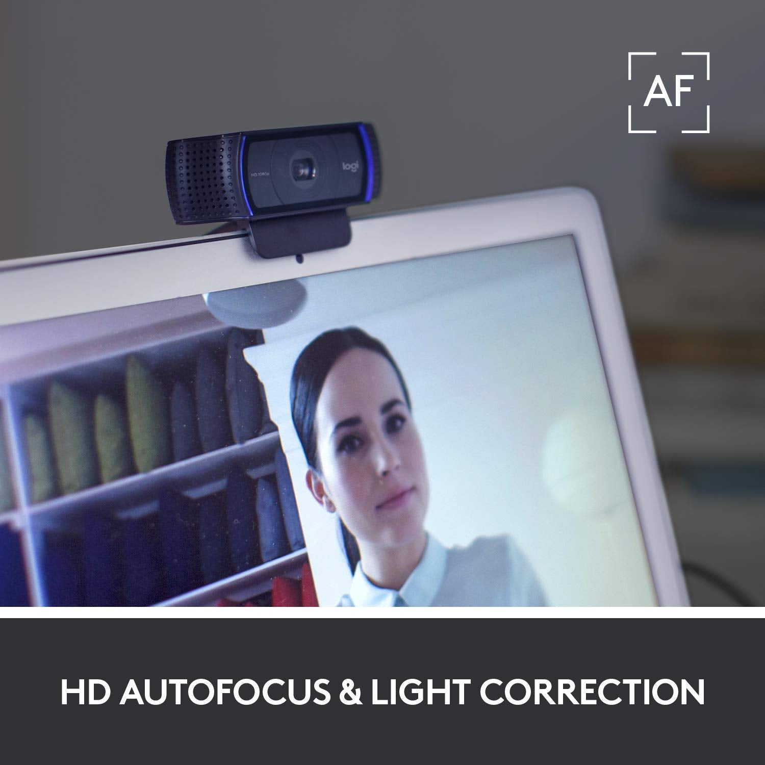 Logitech C920x HD Pro Webcam mounted on laptop with HD autofocus and light correction