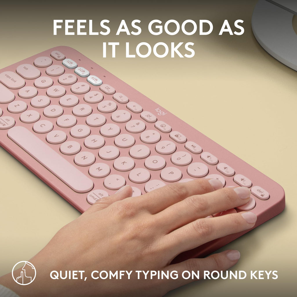 Logitech Pebble Keys 2 K380s wireless keyboard in pink with round keys and hand typing