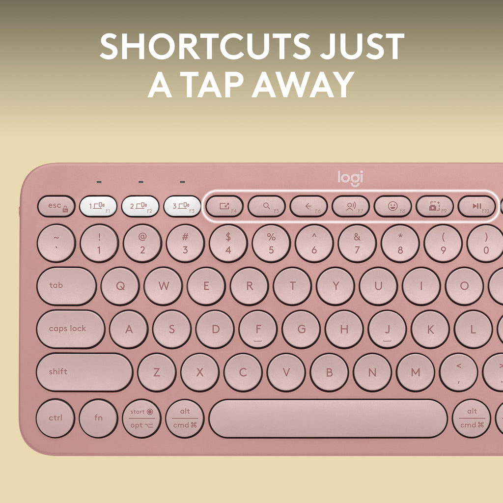 Close-up of rose pink Logitech Pebble Keys 2 K380s wireless keyboard showing round keys and shortcut buttons