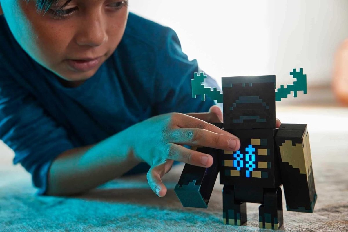 Child playing with Minecraft Warden action figure in a blue long sleeve shirt on carpet