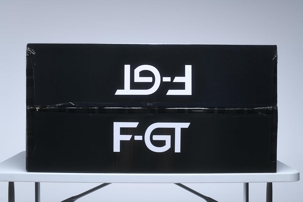 Black shipping box with white F-GT logo containing Next Level Racing F-GT simulator cockpit by craques