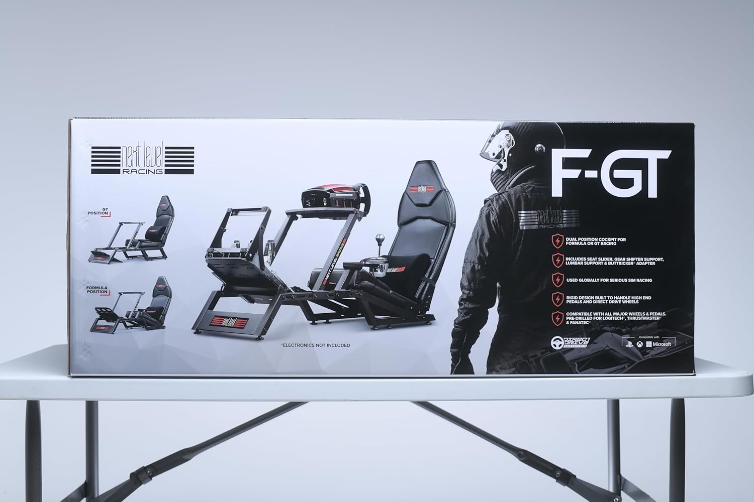 Next Level Racing F-GT simulator cockpit packaging box with racing seat and frame design