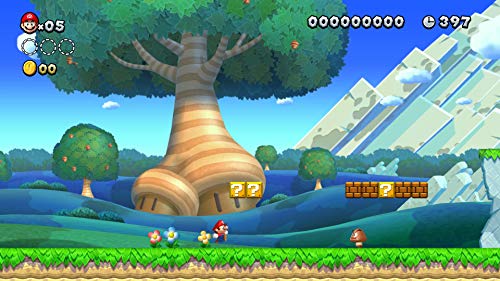 Gameplay screenshot of Super Mario Bros U Deluxe Switch showing Mario running near a large tree and question blocks