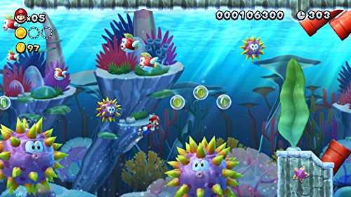 Underwater level gameplay scene from Super Mario Bros U Deluxe Switch featuring Mario swimming among enemies