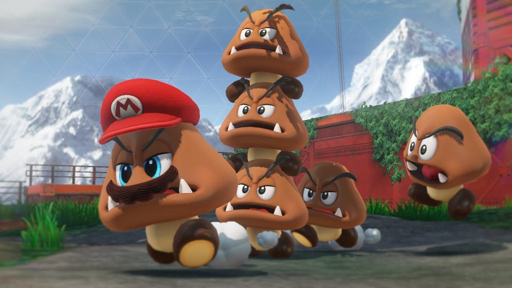 Super Mario Odyssey Nintendo Switch game scene featuring Mario and a stack of Goombas in a mountainous outdoor setting