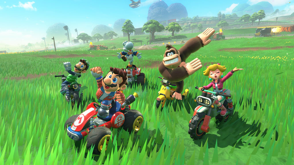 Mario, Luigi, Donkey Kong, and Peach racing on vehicles in Nintendo Switch 2 console bundle game