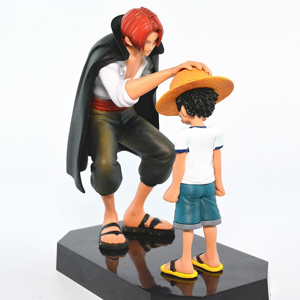 One Piece Shanks and Luffy action figure showing Shanks placing a hat on Luffy's head on black base
