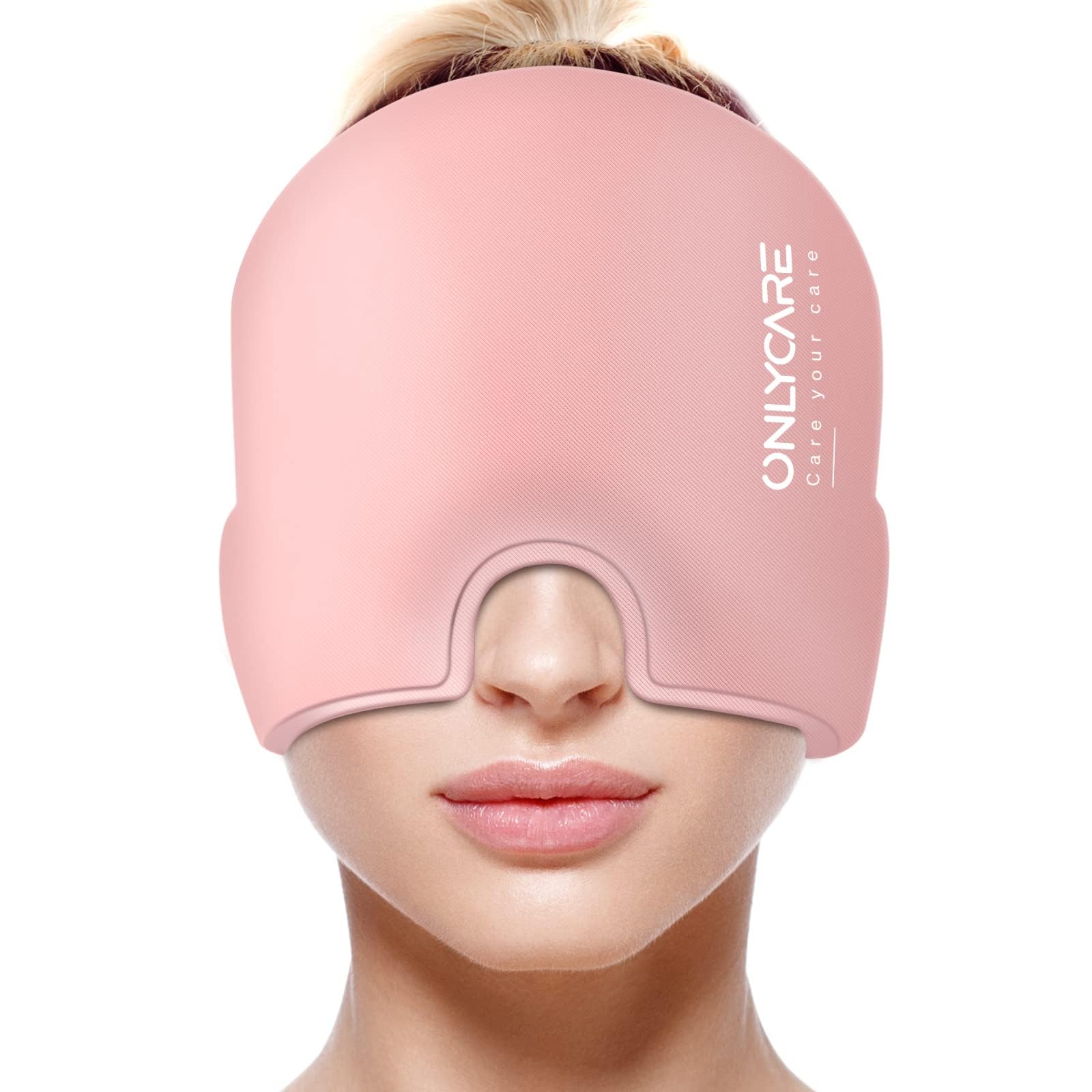 Pink migraine relief cap by craques worn over eyes and forehead for soothing headache relief