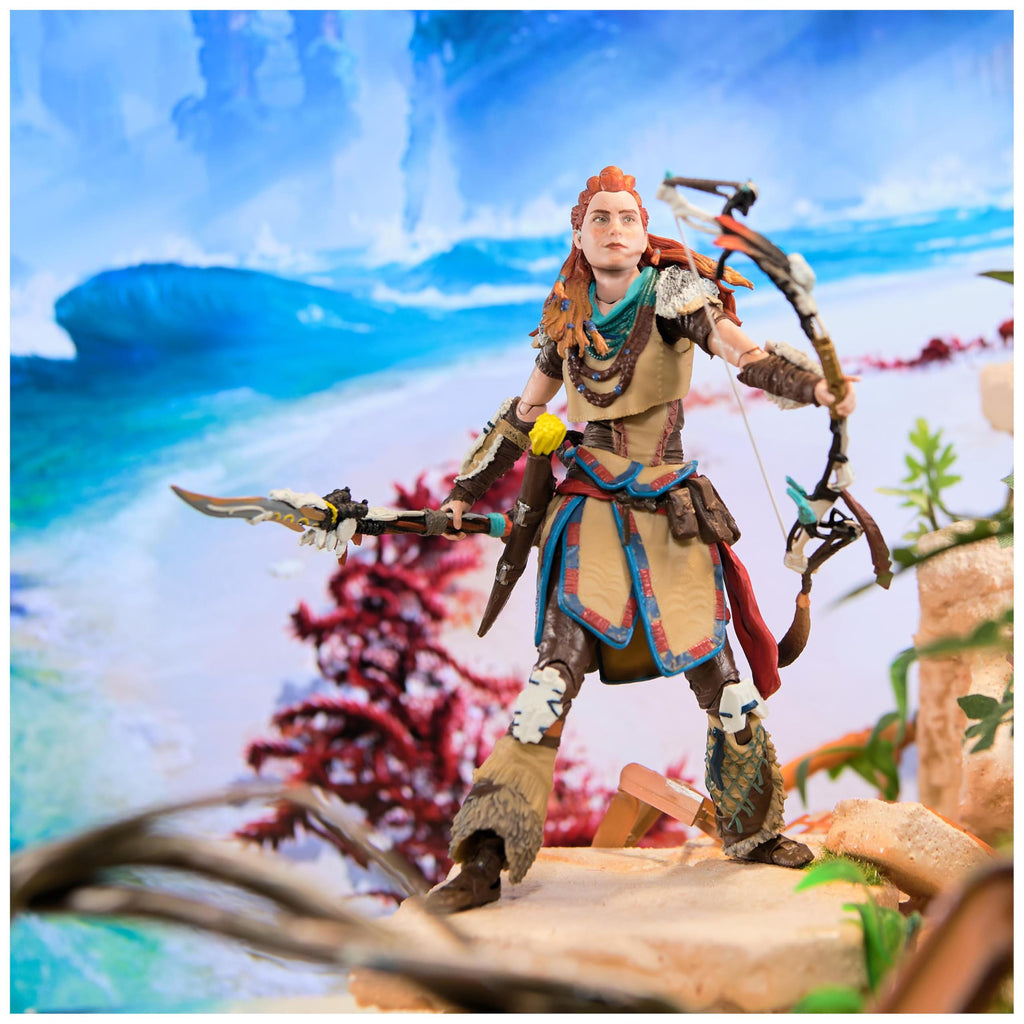 Kratos God of War Ragnarök action figure posed with bow and spear in detailed fantasy landscape background