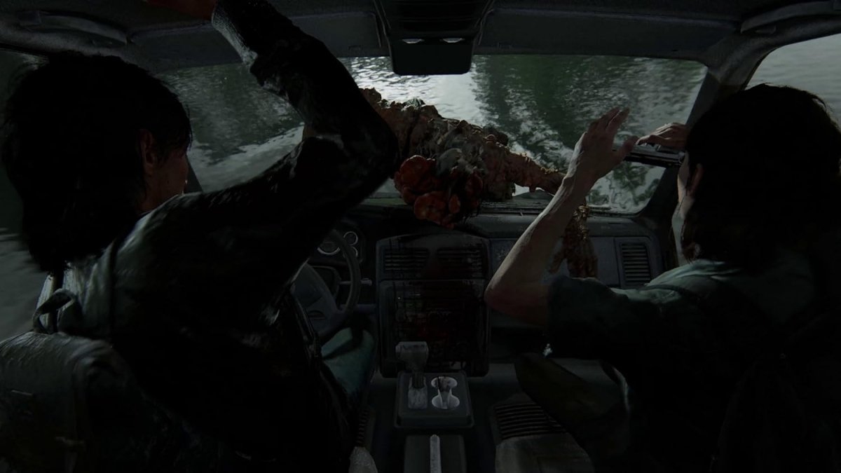In-game scene from The Last of Us Part II Remastered PS5 showing characters inside a vehicle with a creature attacking