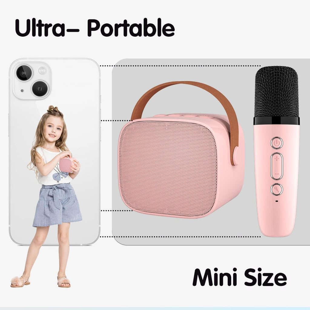 Pink portable karaoke machine for kids with microphone and speaker showing mini size comparison with girl and smartphone