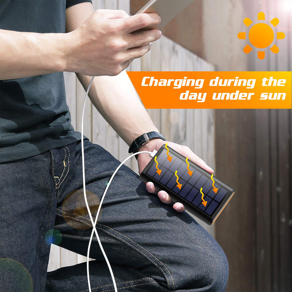 craques portable solar charger power bank charging a smartphone outdoors under sunlight