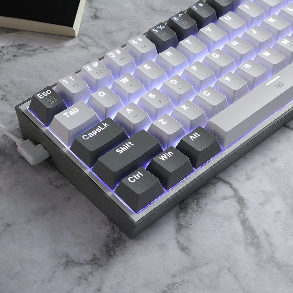Craques 60% mechanical gaming keyboard with black and white keycaps and white backlighting on marble surface