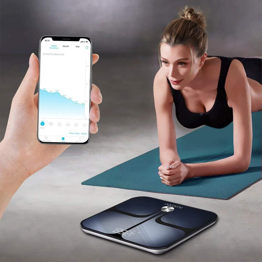 Craques smart digital body fat scale with mobile app showing health tracking and woman exercising on a mat