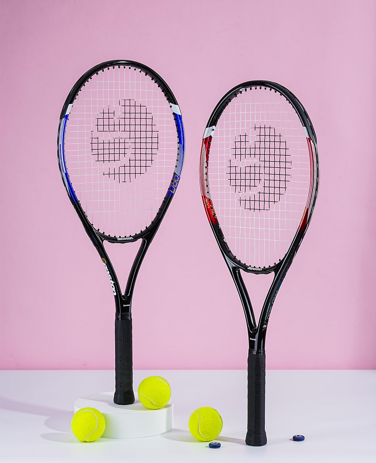 Two craques 27 inch tennis racket for adults with black handles and tennis balls on white and pink background